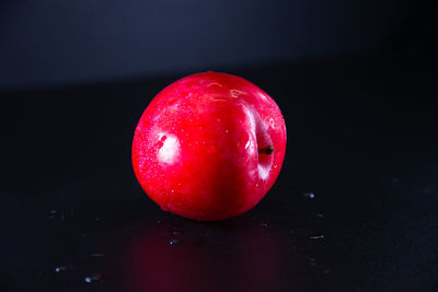 Close-up of tomato against black background