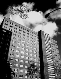 Low angle view of building against cloudy sky