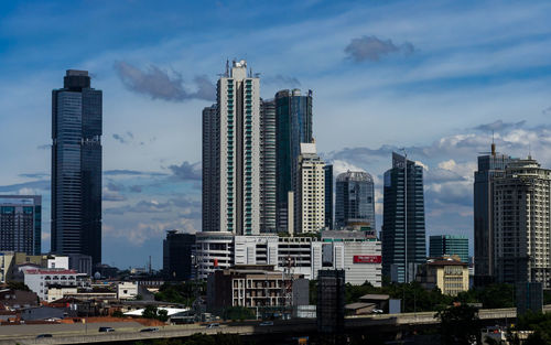 Skyscrapers in city against sky