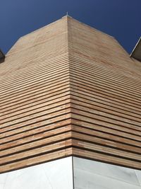 Low angle view of building against blue sky