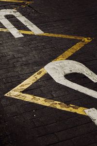 High angle view of arrow sign on road