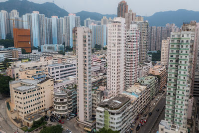 High angle view of buildings in city against sky