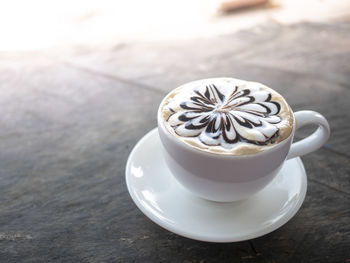 Close-up of coffee cup on table