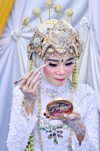 Portrait of young woman wearing traditional clothing