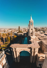 Low angle view of historic building against clear blue sky