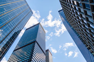 Low angle view of modern buildings against sky