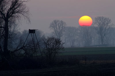 Scenic view of landscape against sky during sunset