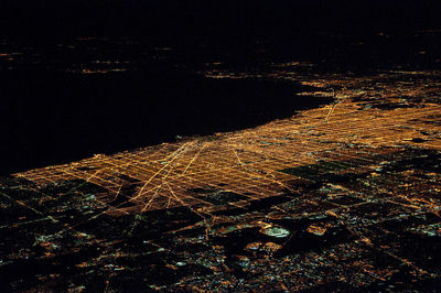 Aerial view of illuminated city at night