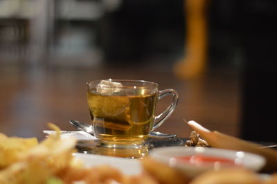 Close-up of tea in glass on table