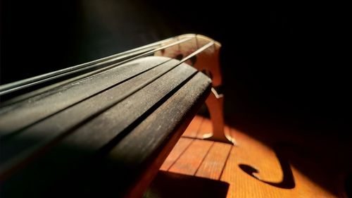 Close-up of guitar on table