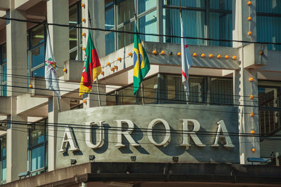 Low angle view of flag against building in city