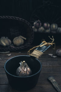 Close-up of garlic in pan on table