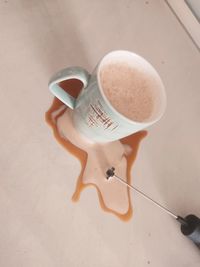 High angle view of coffee cup on floor