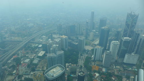 High angle view of buildings in city against sky