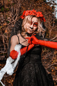 Closeup portrait of calavera catrina. young woman with sugar skull makeup and white spiderweb. dia