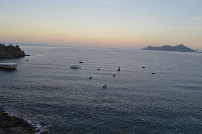 High angle view of sea against sky at sunset