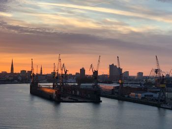 View of commercial dock against sky during sunset