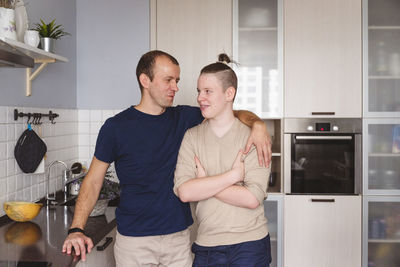 Young couple kissing at home