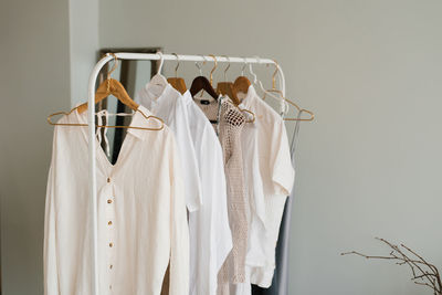 Modern interior of an open dressing room with a hanger for stylish women's clothing