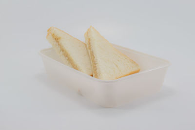 Close-up of cake against white background