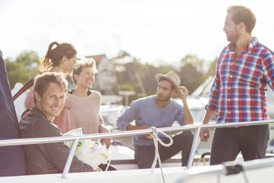 Happy friends enjoying on yacht