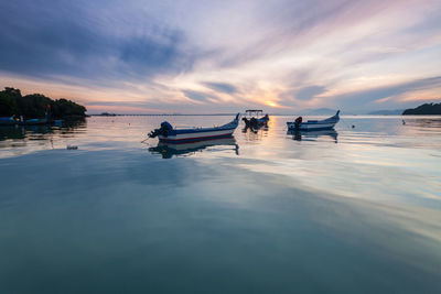 Scenic view of lake against sky during sunset