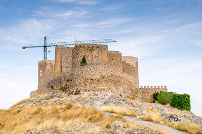 Old ruin building against sky