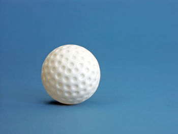 High angle view of ball against blue background