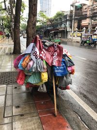 Man with umbrella on street in city