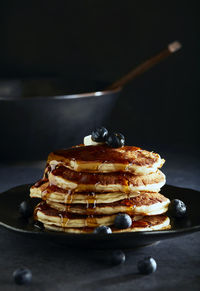 Stack of blueberry pancakes with syrup