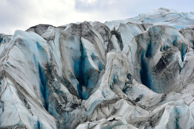 Full frame shot of glacier ice against sky