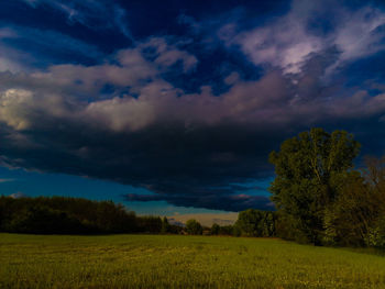 Scenic view of field against sky during sunset