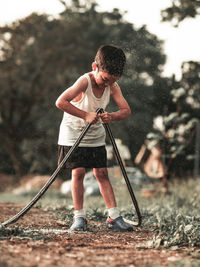 Man holding umbrella while standing on land