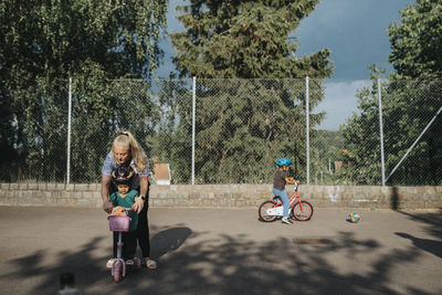 Mother and daughters spending time actively outdoors