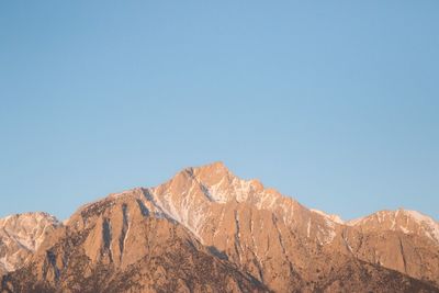 Scenic view of mountain against clear blue sky
