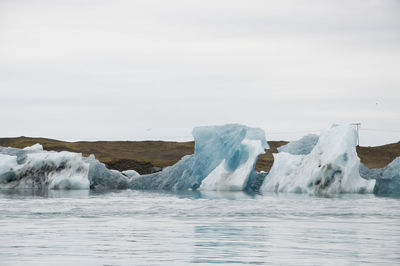 Scenic view of frozen sea against sky