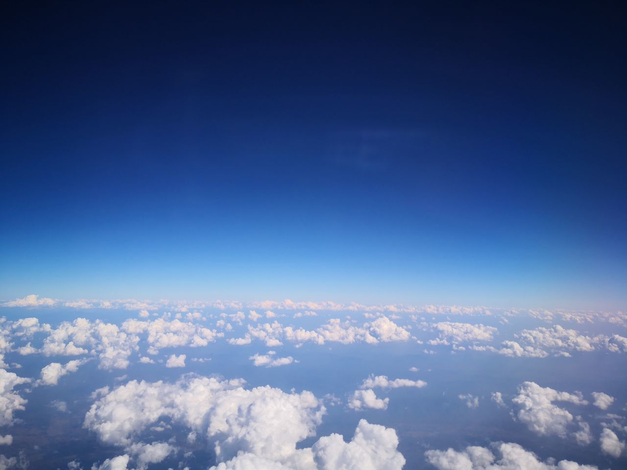 AERIAL VIEW OF CLOUDSCAPE AGAINST SKY