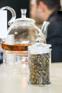 Close-up of drink in glass jar on table