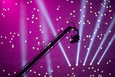 Low angle view of silhouette camera during concert