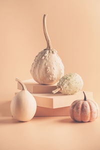 Close-up of christmas decorations on table against white background