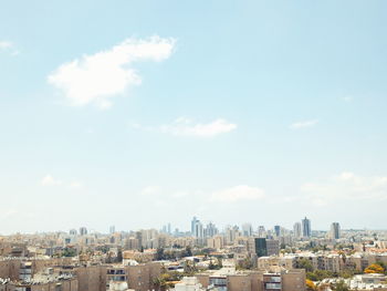 Buildings in city against sky