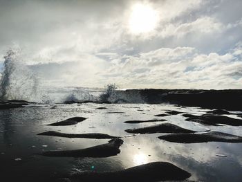 Scenic view of sea against sky during winter