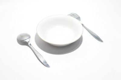 High angle view of breakfast on table against white background