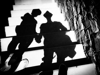 Shadow of couple on stairs