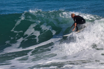 Man surfing in sea