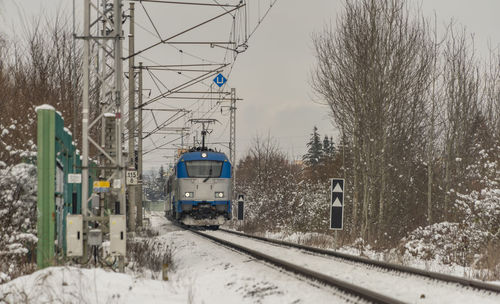 Train on railroad tracks during winter