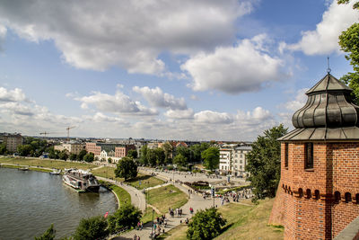 High angle view of buildings and river against sky