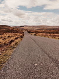 Surface level of road against sky