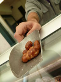 Cropped image of woman holding food