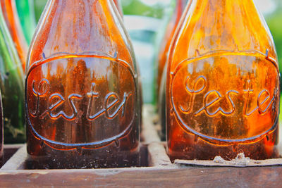 Close-up of glass bottle with text